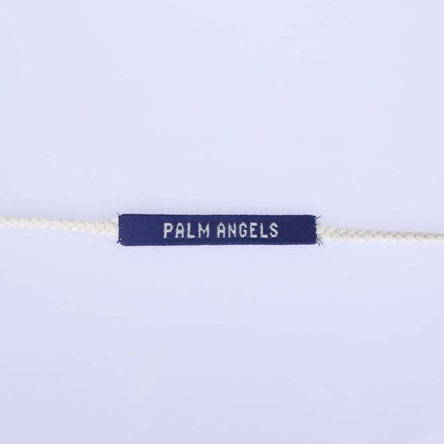 Palm Angels Logo Armband. Geborduurd met het logo van het merk, heeft dit item franje details.- Knoopsluiting.- Tweekleurig ontwerp.- Geweven effect.- Logo print op de voorkant. Materiaal: 100% polyester. Ref: PMOA0130014503.