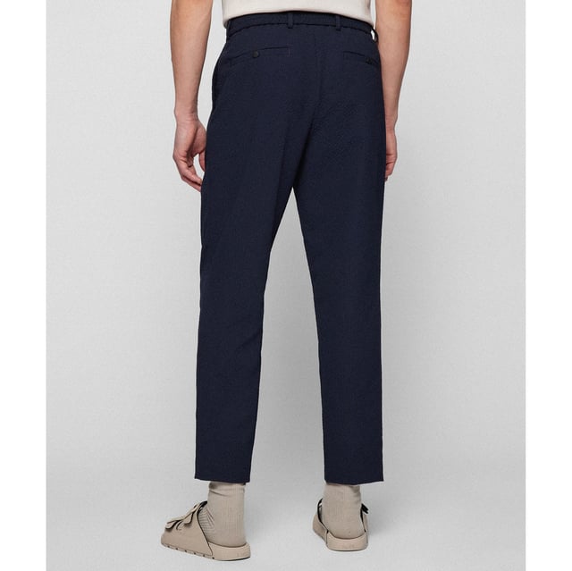 Hook eye and zip fastening.Elasticated drawstring waist.Slit side pockets.Slightly tapered cut.