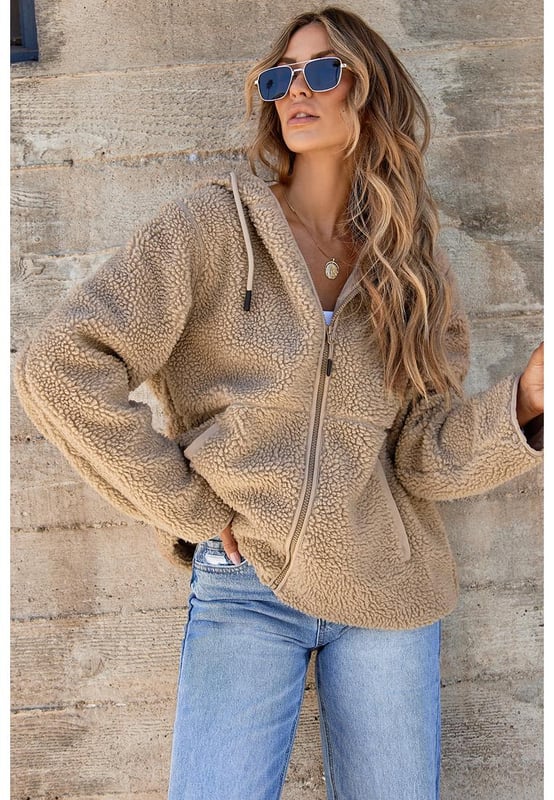 Pale Khaki Fleece Zip Up Drawstring Hooded Pocketed Jacket
  Adjustable hood with drawstring for a personalized fit
  Convenient side pockets for storing essentials
  Versatile piece for layering or wearing on its own
  Perfect for chilly days and cozy nights
Material: 100% Polyester