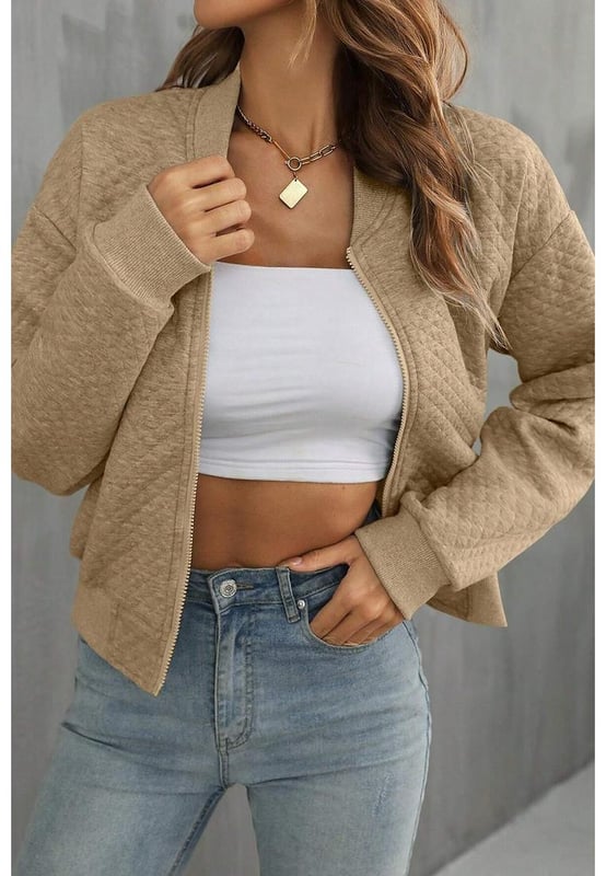 Our styles are designed with a trendy fitted look in mind following an international size standard. For the best fit we suggest choosing one size up from your usual. Be sure to check our sizing chart to find your perfect match!
  Stylish and comfortable option for a casual look
  Geometric texture design adds visual interest
  Baseball collar provides a sporty and modern touch
  Solid color makes it easy to pair with different outfits
  Ideal for transitional seasons or cool evenings
  Medium elasticity for added comfort
Material: 97% Polyester 3% Elastane