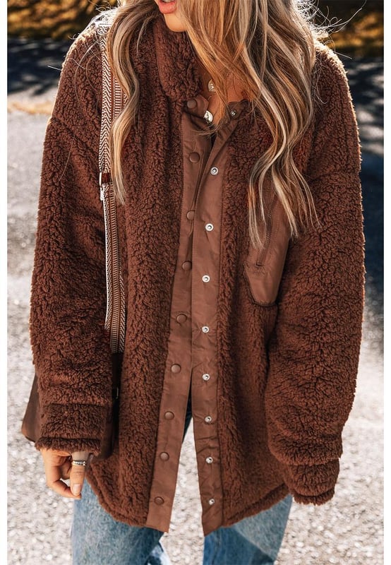 Our styles are designed with a trendy fitted look in mind following an international size standard. For the best fit we suggest choosing one size up from your usual. Be sure to check our sizing chart to find your perfect match!
  Luxurious sherpa plush material for ultimate warmth and comfort
  Adorable teddy bear style adds a playful touch to your outfit
  Convenient snap button closure for easy wear and a secure fit
  Classic collared design for a timeless and stylish look