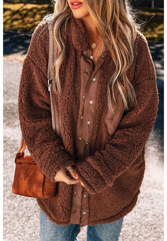 Our styles are designed with a trendy fitted look in mind following an international size standard. For the best fit we suggest choosing one size up from your usual. Be sure to check our sizing chart to find your perfect match!
  Luxurious sherpa plush material for ultimate warmth and comfort
  Adorable teddy bear style adds a playful touch to your outfit
  Convenient snap button closure for easy wear and a secure fit
  Classic collared design for a timeless and stylish look