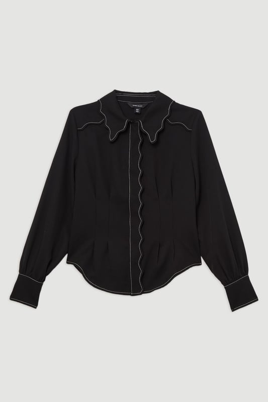 Add a little formality in our blouse. The scalloped design gives a playful yet elevated feel, and the relaxed silhouette makes for a comfortable blouse that can be worn from day to night. This piece pairs well with anything, from a flowing maxi skirt, to tailored trousers, to jeans for an elevated daytime look. Scallop Trim Woven Crepe Blouse High Quality Crepe Fabric Textured, Scalloped Details High, Collared Neckline Relaxed Fit Contrast Stitch Detailing