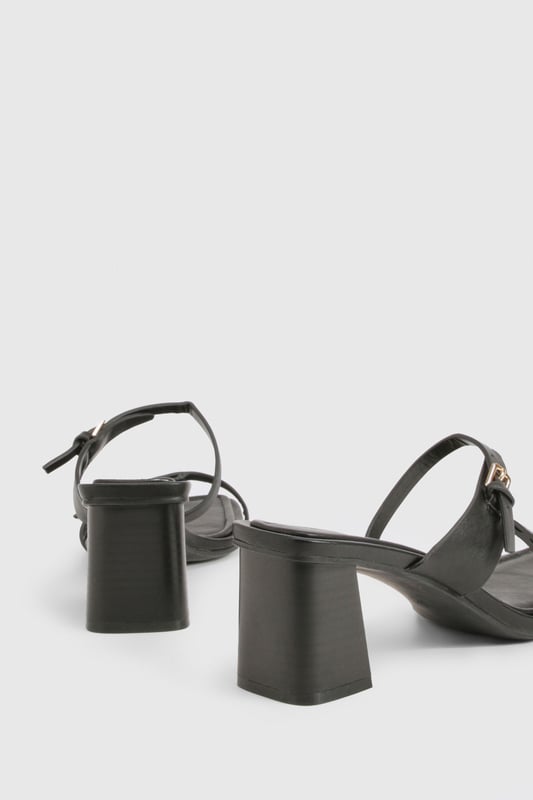 Chic block heel design for comfortable all-day wear
        Adjustable ankle strap with buckle closure for a secure fit
        Versatile low heel height between 2.5 and 4.5cm
        Sleek square toe for a modern, on-trend look
        Multiple thin straps across the foot for added style and support
    
    Step out in style with these versatile block heel sandals, perfect for the fashion-forward woman who values both comfort and trend-setting looks. The low heel height offers stability and ease of movement, making these an ideal choice for various occasions. Pair them with a flowing maxi dress for a bohemian-inspired daytime ensemble, or team them with cropped trousers and a blazer for a smart-casual office look. The adjustable ankle strap ensures a customised fit, while the multiple thin straps add a touch of elegance to your feet. These sandals effortlessly transition from day to night, making them a must-have addition to your wardrobe. Whether you're attending a casual garden party or meeting friends for brunch, these heels will keep you looking chic and feeling confident all day long.
