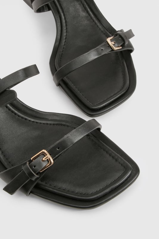 Chic block heel design for comfortable all-day wear
        Adjustable ankle strap with buckle closure for a secure fit
        Versatile low heel height between 2.5 and 4.5cm
        Sleek square toe for a modern, on-trend look
        Multiple thin straps across the foot for added style and support
    
    Step out in style with these versatile block heel sandals, perfect for the fashion-forward woman who values both comfort and trend-setting looks. The low heel height offers stability and ease of movement, making these an ideal choice for various occasions. Pair them with a flowing maxi dress for a bohemian-inspired daytime ensemble, or team them with cropped trousers and a blazer for a smart-casual office look. The adjustable ankle strap ensures a customised fit, while the multiple thin straps add a touch of elegance to your feet. These sandals effortlessly transition from day to night, making them a must-have addition to your wardrobe. Whether you're attending a casual garden party or meeting friends for brunch, these heels will keep you looking chic and feeling confident all day long.