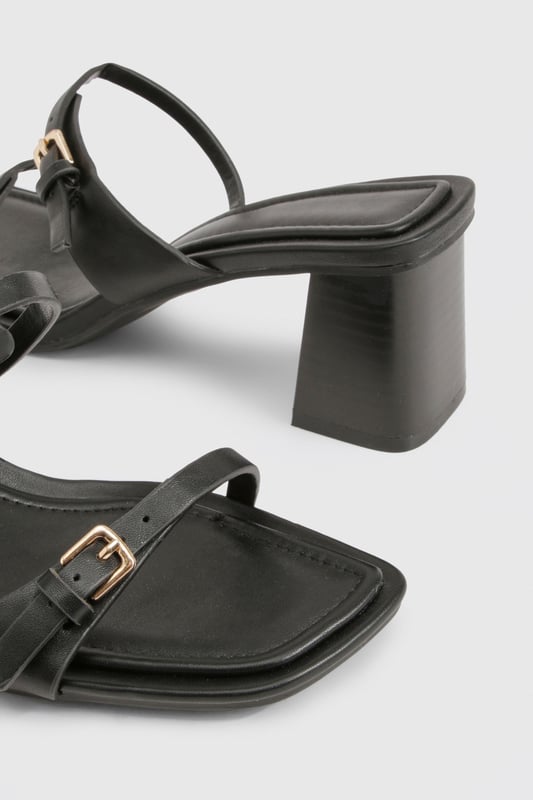 Chic block heel design for comfortable all-day wear
        Adjustable ankle strap with buckle closure for a secure fit
        Versatile low heel height between 2.5 and 4.5cm
        Sleek square toe for a modern, on-trend look
        Multiple thin straps across the foot for added style and support
    
    Step out in style with these versatile block heel sandals, perfect for the fashion-forward woman who values both comfort and trend-setting looks. The low heel height offers stability and ease of movement, making these an ideal choice for various occasions. Pair them with a flowing maxi dress for a bohemian-inspired daytime ensemble, or team them with cropped trousers and a blazer for a smart-casual office look. The adjustable ankle strap ensures a customised fit, while the multiple thin straps add a touch of elegance to your feet. These sandals effortlessly transition from day to night, making them a must-have addition to your wardrobe. Whether you're attending a casual garden party or meeting friends for brunch, these heels will keep you looking chic and feeling confident all day long.