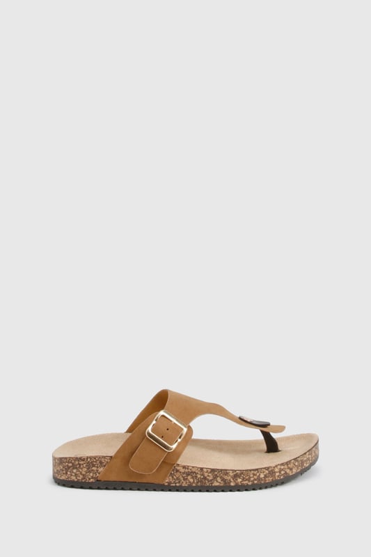 Trendy toe-post design for a classic summer look
        Adjustable buckle strap for a customised fit
        Comfortable cork-effect footbed for all-day wear
        Flat heel between 0 and 2cm for easy walking
        Versatile style suitable for various casual occasions
    
    Step into summer with these effortlessly chic slides from Boohoo. Perfect for the fashion-forward woman who values both style and comfort, these sandals are a must-have for your warm-weather wardrobe. The toe-post design adds a touch of classic appeal, while the adjustable buckle strap ensures a snug, personalised fit. Pair them with a flowing maxi dress and oversized sunglasses for a leisurely brunch date, or slip them on with denim shorts and a crop top for a casual day out shopping. The cork-effect footbed not only adds visual interest but also provides comfort for extended wear. Whether you're heading to a family barbecue or a casual catch-up with friends, these versatile slides will keep you looking stylish and feeling comfortable all day long.