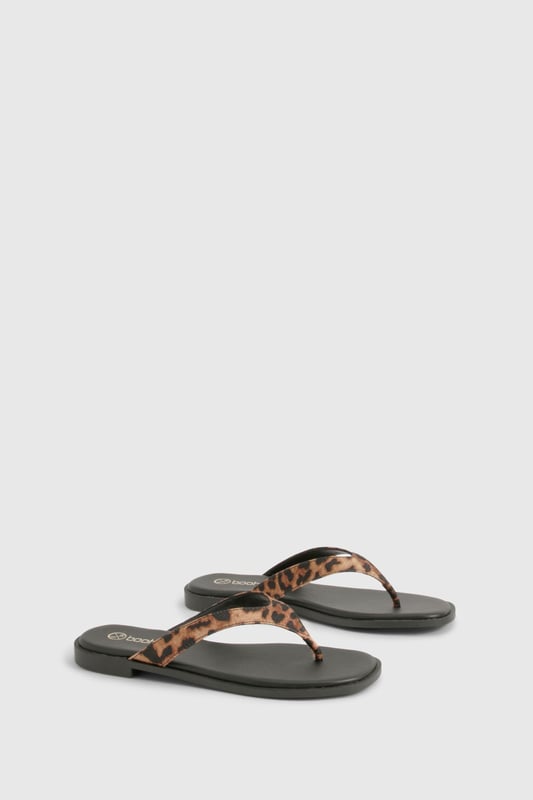 Chunky strap flip-flops featuring an eye-catching animal print design
        Satin finish straps for a touch of luxe texture
        Flat heel measuring between 0-2cm for all-day comfort
        Durable sole with subtle branding detail
        Regular fit toe post design for easy wear
    
    These statement flip-flops combine practicality with on-trend style, perfect for the fashion-forward woman who values both comfort and flair. The chunky straps with their striking animal print pattern add a bold touch to even the simplest outfit, whilst the satin finish introduces a subtle sheen that catches the light beautifully. Pair with cropped jeans and an oversized tee for casual coffee dates, or style with a floaty maxi dress for laid-back summer gatherings. The flat design ensures these sandals remain comfortable throughout long days of wear, making them an ideal choice for holiday sightseeing or festival adventures. Their versatility means they'll transition effortlessly from beachside to city streets, offering a stylish footwear solution for the British summer and beyond. A true wardrobe essential that brings a touch of wild charm to your everyday look.