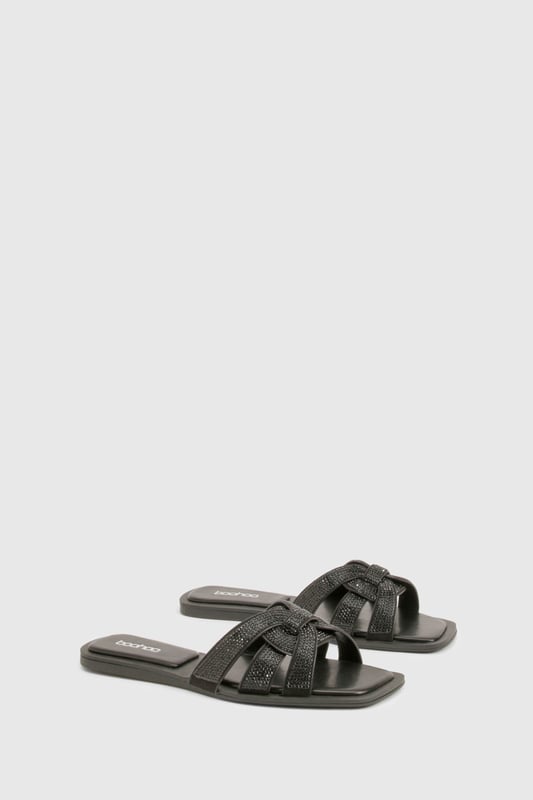 Stylish cut-out design with knotted straps
        Sparkling rhinestone embellishments for added glamour
        Flat heel (0-2cm) for all-day comfort
        Slip-on style for easy wear
        Versatile sandal suitable for various casual occasions
    
    These chic cut-out sandals are the perfect blend of style and comfort for the fashion-forward woman. The intricate knotted straps create an eye-catching design, while the sparkling rhinestones add a touch of glamour to elevate any casual ensemble. With their flat heel, these sandals are ideal for long days out and about, offering both comfort and style in equal measure. Pair them with your favourite summer dress for a family barbecue, or slip them on with cropped trousers for a leisurely weekend brunch with friends. The versatile design makes these sandals a go-to choice for various casual events, from shopping trips to seaside strolls. Their slip-on style ensures quick and easy wear, perfect for those on-the-go moments when you need to dash out the door in style.