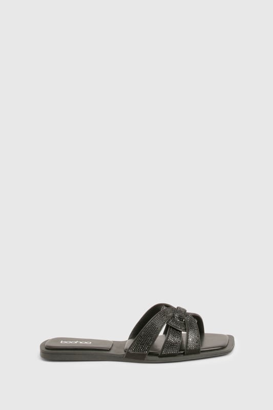 Stylish cut-out design with knotted straps
        Sparkling rhinestone embellishments for added glamour
        Flat heel (0-2cm) for all-day comfort
        Slip-on style for easy wear
        Versatile sandal suitable for various casual occasions
    
    These chic cut-out sandals are the perfect blend of style and comfort for the fashion-forward woman. The intricate knotted straps create an eye-catching design, while the sparkling rhinestones add a touch of glamour to elevate any casual ensemble. With their flat heel, these sandals are ideal for long days out and about, offering both comfort and style in equal measure. Pair them with your favourite summer dress for a family barbecue, or slip them on with cropped trousers for a leisurely weekend brunch with friends. The versatile design makes these sandals a go-to choice for various casual events, from shopping trips to seaside strolls. Their slip-on style ensures quick and easy wear, perfect for those on-the-go moments when you need to dash out the door in style.