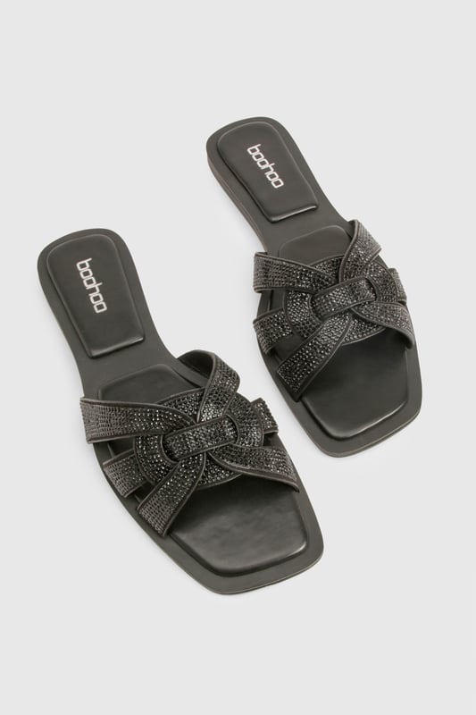 Stylish cut-out design with knotted straps
        Sparkling rhinestone embellishments for added glamour
        Flat heel (0-2cm) for all-day comfort
        Slip-on style for easy wear
        Versatile sandal suitable for various casual occasions
    
    These chic cut-out sandals are the perfect blend of style and comfort for the fashion-forward woman. The intricate knotted straps create an eye-catching design, while the sparkling rhinestones add a touch of glamour to elevate any casual ensemble. With their flat heel, these sandals are ideal for long days out and about, offering both comfort and style in equal measure. Pair them with your favourite summer dress for a family barbecue, or slip them on with cropped trousers for a leisurely weekend brunch with friends. The versatile design makes these sandals a go-to choice for various casual events, from shopping trips to seaside strolls. Their slip-on style ensures quick and easy wear, perfect for those on-the-go moments when you need to dash out the door in style.