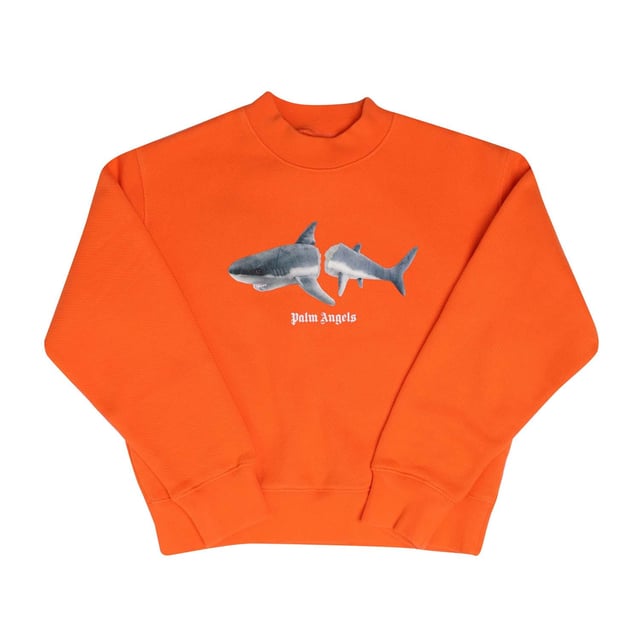 Juniors Palm Angels Shark Crewneck Sweatshirt in orange.- Ribbed mock neck.- Ribbed cuffs and hem.- Palm Angels logo printed at front.- Broken shark printed logo.- 100% Cotton.- Ref: PBBA0020032006