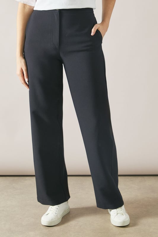 Tailored tapered design for a sophisticated silhouette
        Comfortable regular fit with a flattering waistline
        Versatile woven fabric suitable for various occasions
        Sleek side pockets for practicality and style
        Full-length trousers with a modern straight leg
    
    Embrace effortless elegance with these tailored tapered trousers from Wallis. Perfect for the woman who appreciates both comfort and style, these trousers offer a regular fit that flatters various body types. The tapered design creates a sleek silhouette, making them ideal for casual daywear or smart-casual events. Style them with a crisp white blouse and trainers for a chic everyday look, or pair them with a matching blazer for a coordinated ensemble that's perfect for family gatherings or casual work environments. The versatile nature of these trousers allows for easy transition from day to night - simply swap your flats for a pair of low heels and add some statement jewellery for an evening out. With their timeless design and comfortable fit, these trousers are sure to become a staple in your wardrobe, offering endless styling possibilities for the sophisticated woman on the go.