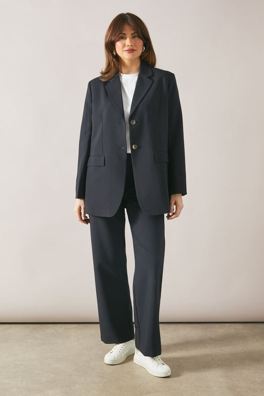Tailored tapered design for a sophisticated silhouette
        Comfortable regular fit with a flattering waistline
        Versatile woven fabric suitable for various occasions
        Sleek side pockets for practicality and style
        Full-length trousers with a modern straight leg
    
    Embrace effortless elegance with these tailored tapered trousers from Wallis. Perfect for the woman who appreciates both comfort and style, these trousers offer a regular fit that flatters various body types. The tapered design creates a sleek silhouette, making them ideal for casual daywear or smart-casual events. Style them with a crisp white blouse and trainers for a chic everyday look, or pair them with a matching blazer for a coordinated ensemble that's perfect for family gatherings or casual work environments. The versatile nature of these trousers allows for easy transition from day to night - simply swap your flats for a pair of low heels and add some statement jewellery for an evening out. With their timeless design and comfortable fit, these trousers are sure to become a staple in your wardrobe, offering endless styling possibilities for the sophisticated woman on the go.