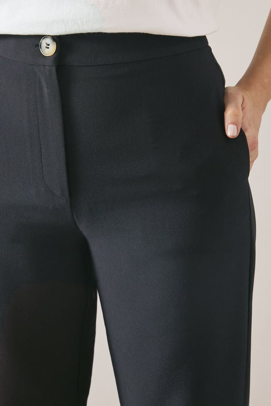 Tailored tapered design for a sophisticated silhouette
        Comfortable regular fit with a flattering waistline
        Versatile woven fabric suitable for various occasions
        Sleek side pockets for practicality and style
        Full-length trousers with a modern straight leg
    
    Embrace effortless elegance with these tailored tapered trousers from Wallis. Perfect for the woman who appreciates both comfort and style, these trousers offer a regular fit that flatters various body types. The tapered design creates a sleek silhouette, making them ideal for casual daywear or smart-casual events. Style them with a crisp white blouse and trainers for a chic everyday look, or pair them with a matching blazer for a coordinated ensemble that's perfect for family gatherings or casual work environments. The versatile nature of these trousers allows for easy transition from day to night - simply swap your flats for a pair of low heels and add some statement jewellery for an evening out. With their timeless design and comfortable fit, these trousers are sure to become a staple in your wardrobe, offering endless styling possibilities for the sophisticated woman on the go.