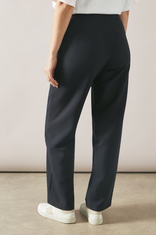 Tailored tapered design for a sophisticated silhouette
        Comfortable regular fit with a flattering waistline
        Versatile woven fabric suitable for various occasions
        Sleek side pockets for practicality and style
        Full-length trousers with a modern straight leg
    
    Embrace effortless elegance with these tailored tapered trousers from Wallis. Perfect for the woman who appreciates both comfort and style, these trousers offer a regular fit that flatters various body types. The tapered design creates a sleek silhouette, making them ideal for casual daywear or smart-casual events. Style them with a crisp white blouse and trainers for a chic everyday look, or pair them with a matching blazer for a coordinated ensemble that's perfect for family gatherings or casual work environments. The versatile nature of these trousers allows for easy transition from day to night - simply swap your flats for a pair of low heels and add some statement jewellery for an evening out. With their timeless design and comfortable fit, these trousers are sure to become a staple in your wardrobe, offering endless styling possibilities for the sophisticated woman on the go.