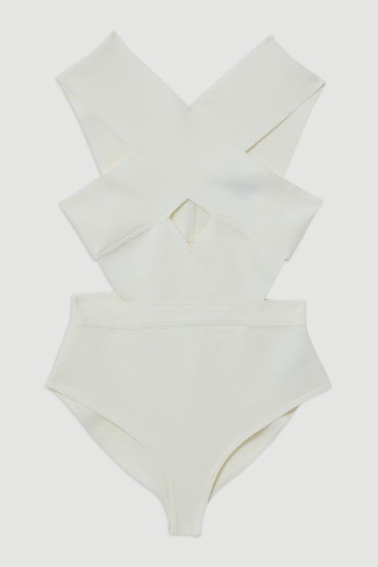 Whilst appropriate for a beach destination, please note that in order to ensure enduring quality, this piece is not recommended for swimming.Style: Cut Out SwimsuitDesign: Plain