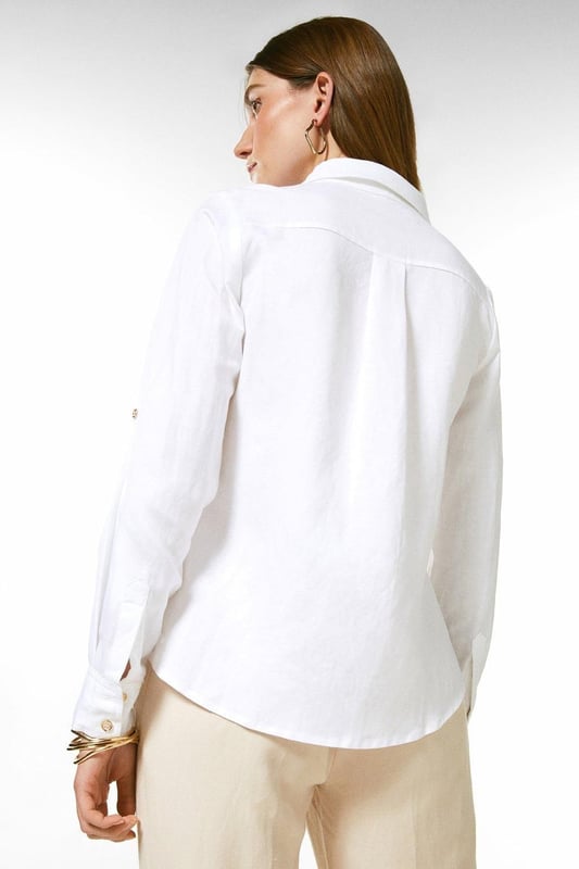 Timeless tailoring is presented with a proportional twist for this lightweight viscose linen shirt. This crisp piece has a point collar detailed with polished golden embossed buttons, and long sleeves. Pair this piece with tailored shorts and flats for a summer ensemble.Point collarButton detailingShirt