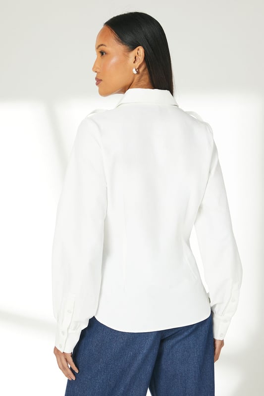 Elegant gathered detailing adds a touch of sophistication
        Long sleeves with subtle volume for a refined silhouette
        Classic collared neckline for a timeless look
        Versatile woven fabric suitable for various occasions
        Button-down front for easy wear and styling options
    
    This Principles gathered detail long sleeve shirt is a versatile addition to your wardrobe, perfect for elevating your everyday style. The subtle gathering adds a feminine touch to the classic shirt design, creating interest without overwhelming the overall look. Style this piece effortlessly for a range of casual events - pair it with wide-leg denim trousers and trainers for a relaxed weekend brunch, or tuck it into a midi skirt with ballet flats for a family gathering. The shirt's adaptable nature allows for easy transition from day to night - simply swap your casual bottoms for tailored trousers and add some statement earrings for an impromptu dinner date. Its neutral palette ensures it will complement a variety of outfits, making it a go-to piece for those moments when you want to look put-together with minimal effort.