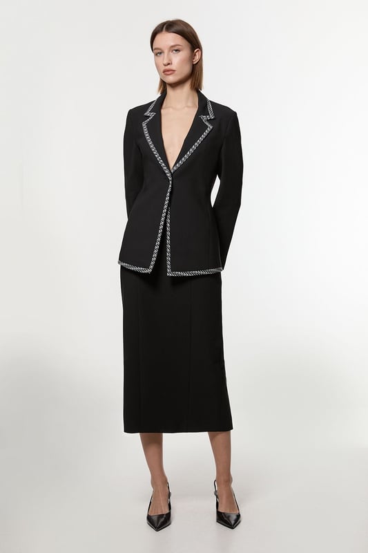 Experience updated wardrobe essentials with our midi skirt, with a straight silhouette and a high waistline, creating a universally flattering fit. The jacquard detailing adds immediate intrigue, elevating this piece beyond a basic. Style this piece with anything, from the matching jacket and strappy heels, to a knit jumper, tights, and boots. Compact Stretch Jacquard Insert Midi Pencil Skirt Sleek, Minimal Design Comfortable High Waistline Flattering Straight Silhouette Unique Insert Details on Hips Zip Back Fastening Matching Jacket Sold Separately