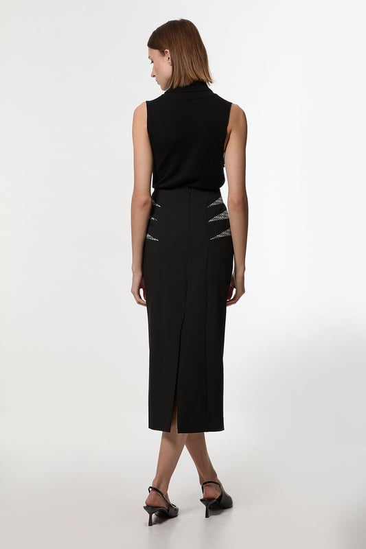 Experience updated wardrobe essentials with our midi skirt, with a straight silhouette and a high waistline, creating a universally flattering fit. The jacquard detailing adds immediate intrigue, elevating this piece beyond a basic. Style this piece with anything, from the matching jacket and strappy heels, to a knit jumper, tights, and boots. Compact Stretch Jacquard Insert Midi Pencil Skirt Sleek, Minimal Design Comfortable High Waistline Flattering Straight Silhouette Unique Insert Details on Hips Zip Back Fastening Matching Jacket Sold Separately