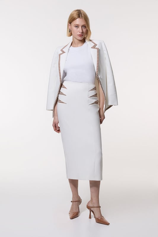 Compact Stretch Jacquard Insert Midi Pencil Skirt Experience updated wardrobe essentials with our midi skirt, with a straight silhouette and a high waistline, creating a universally flattering fit. The jacquard detailing adds immediate intrigue, elevating this piece beyond a basic. Style this piece with anything, from the matching jacket and strappy heels, to a knit jumper, tights, and boots. Compact Stretch Jacquard Insert Midi Pencil Skirt Sleek, Minimal Design Comfortable High Waistline Flattering Straight Silhouette Unique Insert Details on Hips Zip Back Fastening Matching Jacket Sold Separately
