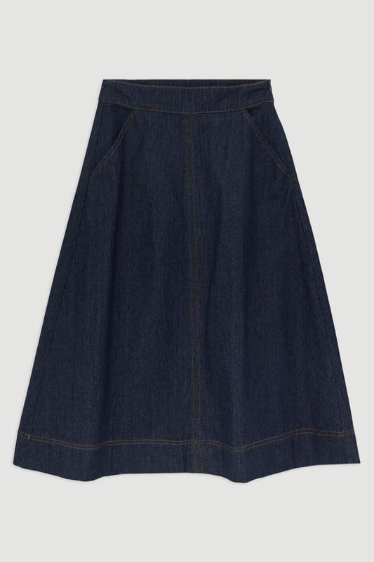 This Karen Millen denim midi skirt is a versatile wardrobe staple that effortlessly bridges the gap between casual and smart-casual attire. The full, flared silhouette creates a graceful movement as you walk, while the high-waisted design accentuates your natural curves. Style it with a fitted knit top and ankle boots for a stylish daytime look, perfect for weekend brunches or casual family gatherings. For a more relaxed vibe, pair it with a simple t-shirt and trainers. The side pockets add a practical touch, ideal for keeping small essentials close at hand. This skirt's adaptable nature makes it suitable for various occasions, from laid-back office days to informal evening outings. Its timeless design ensures it will remain a go-to piece in your wardrobe for seasons to come.  Midi-length denim skirt with a full, flared silhouette High-waisted design for a flattering fit Side pockets for practicality and style Versatile cotton fabric suitable for various seasons Subtle A-line shape creates a feminine profile