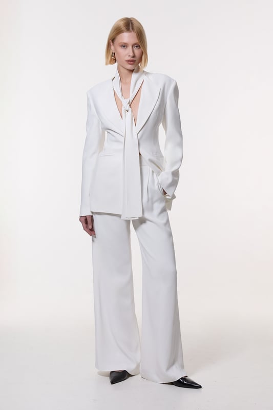 Experience elevated tailoring in a pair of wide leg trousers, with a flattering, relaxed fit and a comfortable high waistline. The sleek design makes them easy to style with anything, from a button up shirt for a formal look, or with a T-shirt and trainers for a more laid back approach. Compact Stretch Viscose Wide Leg Tailored Trouser High Quality Stretch Fabic Comfortable High Waistline Flattering Wide Leg Fit Sleek, Minimal Design Matching Pieces Sold Separately