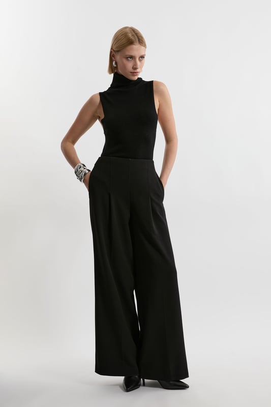 Experience elevated tailoring in a pair of wide leg trousers, with a flattering, relaxed fit and a comfortable high waistline. The sleek design makes them easy to style with anything, from a button up shirt for a formal look, or with a T-shirt and trainers for a more laid back approach. Compact Stretch Essential Wide Leg Tailored Trouser High Quality Stretch Fabic Comfortable High Waistline Flattering Wide Leg Fit Sleek, Minimal Design