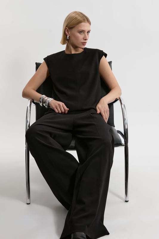 Experience elevated tailoring in a pair of wide leg trousers, with a flattering, relaxed fit and a comfortable high waistline. The sleek design makes them easy to style with anything, from a button up shirt for a formal look, or with a T-shirt and trainers for a more laid back approach. Compact Stretch Essential Wide Leg Tailored Trouser High Quality Stretch Fabic Comfortable High Waistline Flattering Wide Leg Fit Sleek, Minimal Design