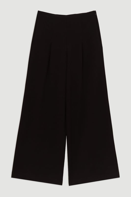 Experience elevated tailoring in a pair of wide leg trousers, with a flattering, relaxed fit and a comfortable high waistline. The sleek design makes them easy to style with anything, from a button up shirt for a formal look, or with a T-shirt and trainers for a more laid back approach. Compact Stretch Essential Wide Leg Tailored Trouser High Quality Stretch Fabic Comfortable High Waistline Flattering Wide Leg Fit Sleek, Minimal Design