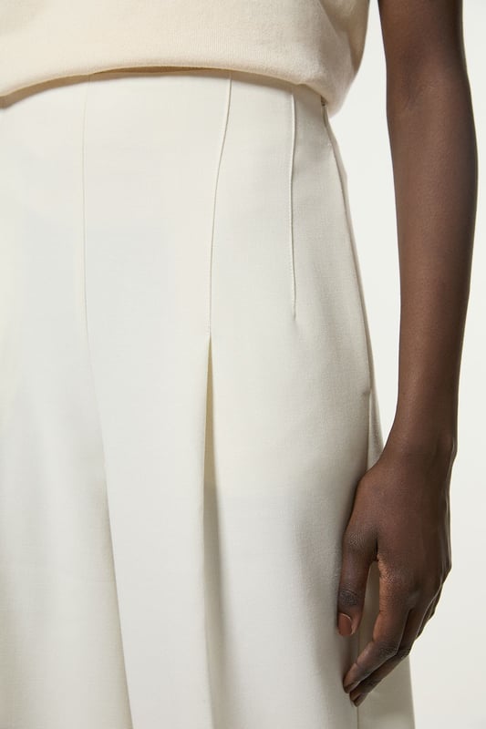 Experience elevated tailoring in a pair of wide leg trousers, with a flattering, relaxed fit and a comfortable high waistline. The sleek design makes them easy to style with anything, from a button up shirt for a formal look, or with a T-shirt and trainers for a more laid back approach. Compact Stretch Essential Wide Leg Tailored Trouser High Quality Stretch Fabic Comfortable High Waistline Flattering Wide Leg Fit Sleek, Minimal Design