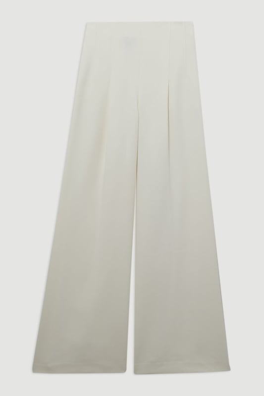 Experience elevated tailoring in a pair of wide leg trousers, with a flattering, relaxed fit and a comfortable high waistline. The sleek design makes them easy to style with anything, from a button up shirt for a formal look, or with a T-shirt and trainers for a more laid back approach. Compact Stretch Essential Wide Leg Tailored Trouser High Quality Stretch Fabic Comfortable High Waistline Flattering Wide Leg Fit Sleek, Minimal Design