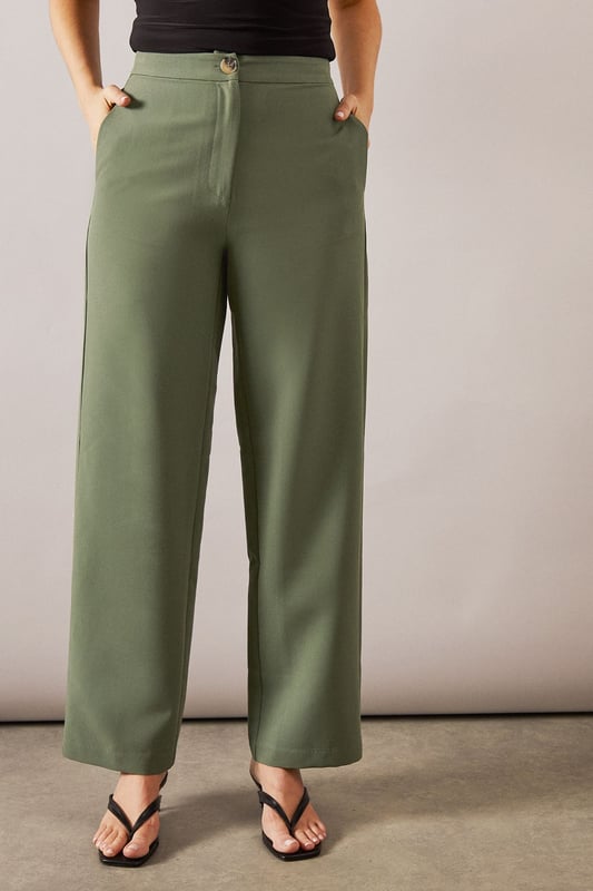 Tailored tapered design for a sophisticated silhouette
        Comfortable regular fit with a flattering waistline
        Versatile woven fabric suitable for various occasions
        Sleek side pockets for practicality and style
        Full-length trousers with a modern straight leg
    
    Embrace effortless elegance with these tailored tapered trousers from Wallis. Perfect for the woman who appreciates both comfort and style, these trousers offer a regular fit that flatters various body types. The tapered design creates a sleek silhouette, making them ideal for casual daywear or smart-casual events. Style them with a crisp white blouse and trainers for a chic everyday look, or pair them with a matching blazer for a coordinated ensemble that's perfect for family gatherings or casual work environments. The versatile nature of these trousers allows for easy transition from day to night - simply swap your flats for a pair of low heels and add some statement jewellery for an evening out. With their timeless design and comfortable fit, these trousers are sure to become a staple in your wardrobe, offering endless styling possibilities for the sophisticated woman on the go.