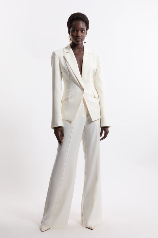 Experience elevated tailoring in a pair of straight leg trousers, featuring a flattering, relaxed fit, seam detailing for a seamless fit, and a comfortable high waistline. The sleek design makes them easy to style with anything, from a crisp button up shirt for a formal look, or with a T-shirt and trainers for a more laid back approach. Tailored Crepe Seam Detail Straight Leg Trousers High Quality Crepe Fabric Comfortable High Waistline Flattering Straight Leg Fit Statement, Pronounced Seam Detailing Pocket Accents Sleek, Minimal Design