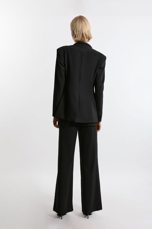 Experience elevated tailoring in a pair of straight leg trousers, featuring a flattering, relaxed fit, seam detailing for a seamless fit, and a comfortable high waistline. The sleek design makes them easy to style with anything, from a crisp button up shirt for a formal look, or with a T-shirt and trainers for a more laid back approach. Tailored Crepe Seam Detail Straight Leg Trousers High Quality Crepe Fabric Comfortable High Waistline Flattering Straight Leg Fit Statement, Pronounced Seam Detailing Pocket Accents Sleek, Minimal Design