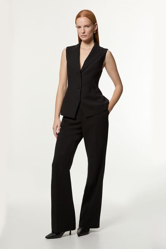 Experience sleek tailoring in a pair of straight leg trousers, with a flattering, relaxed fit and a comfortable high waistline. Style it with the matching waistcoat for a co-ordinating look, or with a knit jumper and boots for a more laid back approach. Compact Stretch Essential Tailored Straight Leg Trouser High Quality Tailored Design Comfortable High Waistline Flattering Straight Leg Fit Pocket Accents Matching Waistcoat Sold SeparatelyShop this seasons straight leg trousers or browse the full collection of women's trousers now.