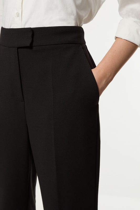 Experience sleek tailoring in a pair of straight leg trousers, with a flattering, relaxed fit and a comfortable high waistline. Style it with the matching waistcoat for a co-ordinating look, or with a knit jumper and boots for a more laid back approach. Compact Stretch Essential Tailored Straight Leg Trouser High Quality Tailored Design Comfortable High Waistline Flattering Straight Leg Fit Pocket Accents Matching Waistcoat Sold SeparatelyShop this seasons straight leg trousers or browse the full collection of women's trousers now.