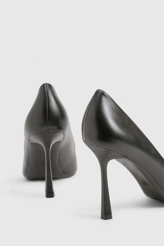 Sleek pointed toe design for a contemporary silhouette
        Elegant stiletto heel measuring between 7-9cm for comfortable height
        Smooth PU finish that maintains its polished appearance
        Classic slip-on style for effortless wear
        Versatile court shoe shape that complements any outfit
    
    These sophisticated pumps are the ultimate wardrobe essential that transition seamlessly from day to night. The pointed toe and perfectly proportioned heel create a flattering line that elongates the leg whilst maintaining comfort for all-day wear. Style with tailored trousers and a crisp blouse for office sophistication, or pair with your favourite jeans and a statement top for evening drinks. For special occasions, these versatile heels complement both midi and mini dresses beautifully. The sleek design works wonderfully with both structured and flowing garments, making these pumps a true style chameleon in your collection. Their timeless appeal ensures they'll remain a go-to choice season after season, offering endless styling possibilities for the fashion-forward woman.