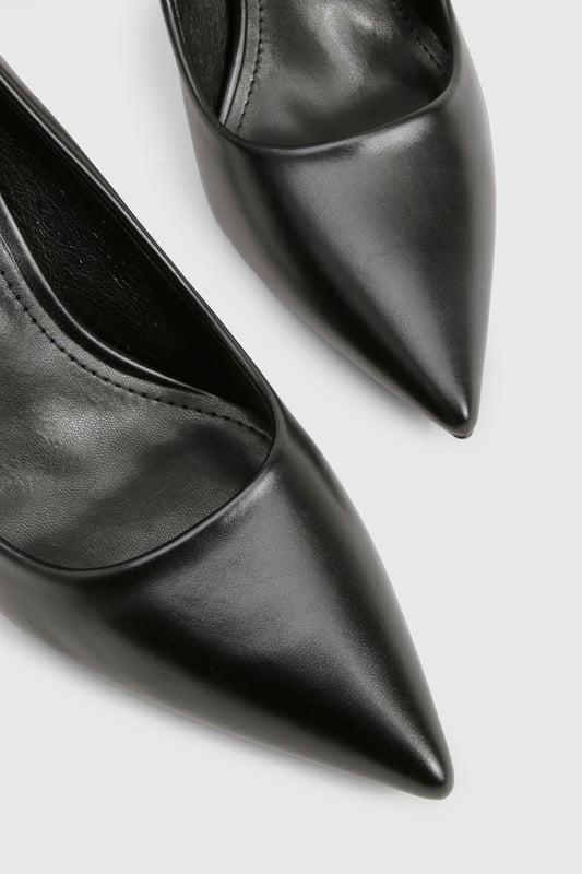 Sleek pointed toe design for a contemporary silhouette
        Elegant stiletto heel measuring between 7-9cm for comfortable height
        Smooth PU finish that maintains its polished appearance
        Classic slip-on style for effortless wear
        Versatile court shoe shape that complements any outfit
    
    These sophisticated pumps are the ultimate wardrobe essential that transition seamlessly from day to night. The pointed toe and perfectly proportioned heel create a flattering line that elongates the leg whilst maintaining comfort for all-day wear. Style with tailored trousers and a crisp blouse for office sophistication, or pair with your favourite jeans and a statement top for evening drinks. For special occasions, these versatile heels complement both midi and mini dresses beautifully. The sleek design works wonderfully with both structured and flowing garments, making these pumps a true style chameleon in your collection. Their timeless appeal ensures they'll remain a go-to choice season after season, offering endless styling possibilities for the fashion-forward woman.