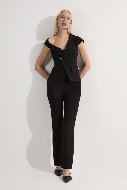 These Karen Millen Compact Stretch Slim Leg Tailored Trousers are the epitome of refined workwear. The slim fit design creates a streamlined look that's both modern and professional. Perfect for the office, these trousers can be styled with a crisp white shirt and blazer for a classic ensemble. The stretch fabric ensures all-day comfort, allowing you to move with ease from morning meetings to evening functions. For a more relaxed yet put-together look, pair with a silk blouse and pointed flats. The versatility of these trousers makes them a wardrobe staple, easily transitioning from day to night with a simple change of accessories. Whether you're presenting to clients or attending a business dinner, these trousers will help you project confidence and sophistication.  Slim leg tailored trousers for a sleek silhouette Compact stretch fabric for comfort and ease of movement Versatile design suitable for various professional settings Clean-cut waistband for a polished appearance Full-length style with a sophisticated straight leg