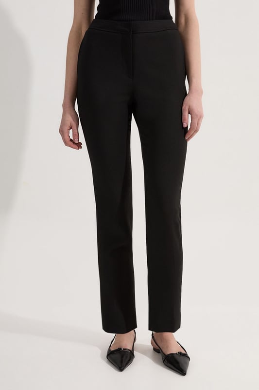 These Karen Millen Compact Stretch Slim Leg Tailored Trousers are the epitome of refined workwear. The slim fit design creates a streamlined look that's both modern and professional. Perfect for the office, these trousers can be styled with a crisp white shirt and blazer for a classic ensemble. The stretch fabric ensures all-day comfort, allowing you to move with ease from morning meetings to evening functions. For a more relaxed yet put-together look, pair with a silk blouse and pointed flats. The versatility of these trousers makes them a wardrobe staple, easily transitioning from day to night with a simple change of accessories. Whether you're presenting to clients or attending a business dinner, these trousers will help you project confidence and sophistication.  Slim leg tailored trousers for a sleek silhouette Compact stretch fabric for comfort and ease of movement Versatile design suitable for various professional settings Clean-cut waistband for a polished appearance Full-length style with a sophisticated straight leg
