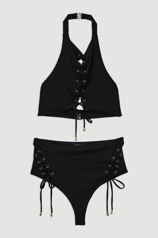 Experience elevated confidence in our halter neck bikini. This piece features a supportive design, accentuated with a strappy design and a secure full coverage design. Style this piece with the matching bikini bottoms and strappy sandals for a holiday outfit perfect for beach clubs, pool parties, and spa days. Slinky Tie Detail Bikini Top Supportive, Wide Shoulder Straps Statement Stitched Design Comfortable, Wide Shoulder Straps SecureFull Coverage Design Halter Bikini Top Style Metallic Clasp Fastenings in Back Matching Bikini Bottoms Sold Separately