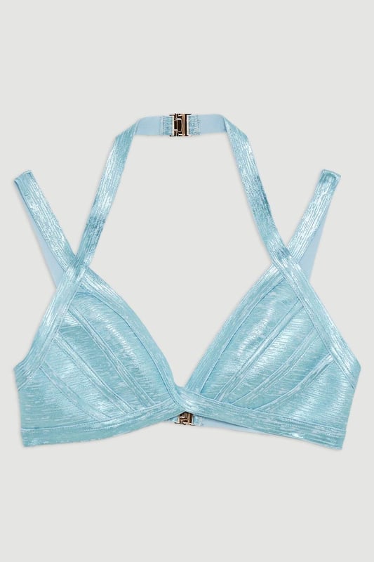 Get holiday ready in a strappy bikini, the top of which features a statement, metallic fabric, and double strap detailing. The secure, bandage style supports the bust, while the double clasp fastening creates a beach-proof fit ideal for swimming and lounging. Style this piece with the matching bottoms, as well as strappy sandals and a beach cover up for a holiday look that can be reworn time and time again. Foiled Bandage Double Strap Bikini Top Unique, Shining Metallic Fabric Statement Double Strap Design Comfortable Triangle Style Double Clasp Fastening Matching Bottoms Sold Separately