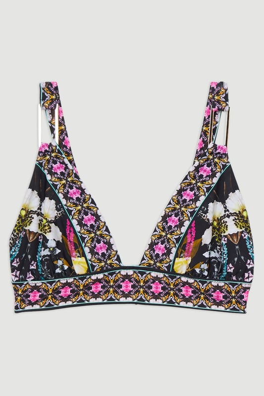Get holiday ready with our bikini top, featuring a flattering plunge neckline, floral pattern, and ring detail. Pair with the matching bikini bottoms, a beach cover-up, and sandals for a day at the pool, or dress it up with wedges and jewellery for an elegant beach club look. Mirror Print Plunge Bikini Top Ring Detail Vibrant Floral Print Plunge Neckline Thick, Supportive Straps Matching Bottoms Sold Seperately