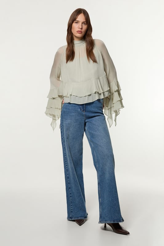 Add a little formality in our tall blouse. The ruffled design gives a playful yet elevated feel, and the relaxed silhouette makes for a comfortable blouse that can be worn from day to night. This piece pairs well with anything, from a flowing maxi skirt, to tailored trousers, to jeans for an elevated daytime look. Tall Drama Kimono Viscose Georgette Woven Blouse High Quality Georgette Fabric Textured, Ruffled Details High Neckline Relaxed Fit Bow Accent in Back Expertly designed for those 5'10" and above, our Tall pieces are perfectly proportioned for a taller frame using longer lengths.Browse this seasons tall tops or discover the full range of tall clothing now.