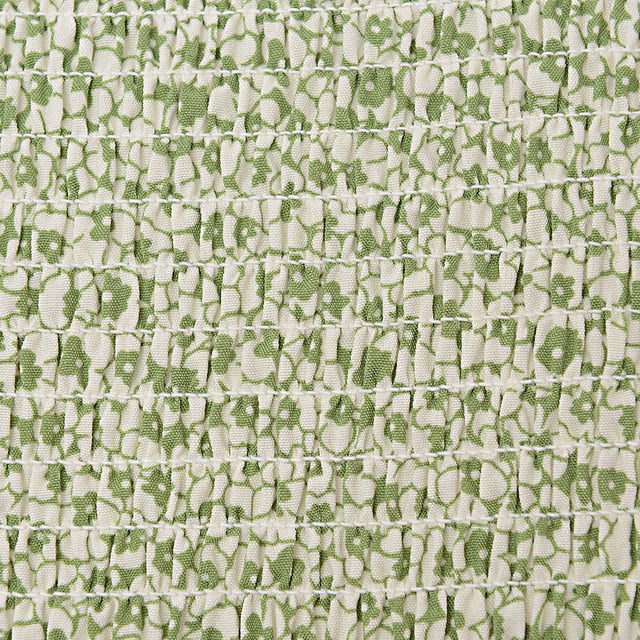 Body: 100% Polyester. A glamorous high neck smock blouse in green floral is the perfect statement piece for any wardrobe. The 100% polyester fabric ensures a comfortable fit and easy care, making it a practical choice for both day-to-day wear and special occasions. Its vibrant green floral pattern exudes a fresh and lively vibe, ideal for those who want to add a touch of nature-inspired elegance to their outfit. Whether paired with jeans for a casual look or a skirt for a more formal ensemble, this blouse is sure to turn heads and elevate any look.
