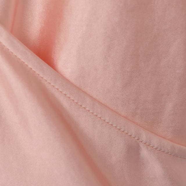 Pretty Lavish Women's Pink High Neck Backless Blouse Main: 97% Polyester, Main: 3% Elastane. The Pretty Lavish high neck backless blouse in blush pink is the epitome of sophistication and elegance. With its long sleeves, it offers a graceful silhouette that's perfect for any upscale event or a chic day at the office. The backless design adds a touch of allure, making it a stunning statement piece that's sure to turn heads. This blouse is a beautiful blend of modern style and timeless sophistication.