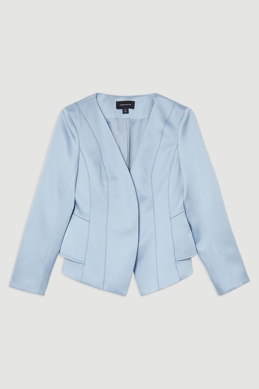 This Karen Millen blazer is a versatile piece that seamlessly transitions from day to night. The structured viscose satin fabric lends a sophisticated sheen, whilst the tailored peplum design creates a figure-flattering shape. Perfect for formal occasions, pair it with matching trousers for a chic suit ensemble or dress it down with dark-wash jeans for a smart-casual look. The stitch detailing adds a touch of refinement, making it an ideal choice for weddings, races, or important business meetings. Layer it over a silk camisole or crisp white shirt for added versatility. This blazer is a wardrobe essential that will serve you well for years to come, offering endless styling possibilities for the fashion-forward British woman.   Structured viscose satin fabric for a luxurious look and feel Tailored peplum design for a flattering silhouette Stitch detail adds subtle texture and visual interest V-neckline creates an elegant and feminine look Slim fit accentuates curves while maintaining a polished appearance