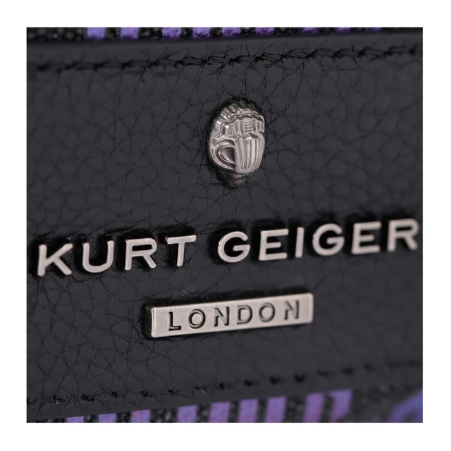 This Small Chiswick Camera Bag from Kurt Geiger features a dark rainbow ombre monogram print across the exterior of the bag. There is a black patch with antiqued silver logo on the front of the bag and open pocket on the back. Dimensions: 13cm (H), 19cm (L), 6cm (D) Strap length: 236cm Woven strap length: 121cm